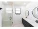 Bathroom with a walk-in shower, double vanity, and modern fixtures at 326 Spinnaker Ct, Auburndale, FL 33823