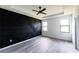 Bedroom with unique geometric black accent wall and ceiling fan at 326 Spinnaker Ct, Auburndale, FL 33823