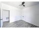 Bright bedroom with ceiling fan and vinyl plank flooring at 326 Spinnaker Ct, Auburndale, FL 33823