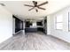 Spacious living room with modern flooring and a ceiling fan at 326 Spinnaker Ct, Auburndale, FL 33823