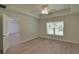 Spacious bedroom with hardwood floors and ceiling fan at 335 Vincent Dr, Mount Dora, FL 32757