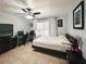 Spacious bedroom with a large bed, home office space, and ample natural light at 3383 Westchester Square Blvd # 202, Orlando, FL 32835