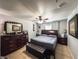 Main bedroom with a king-size bed and a large dresser at 3383 Westchester Square Blvd # 202, Orlando, FL 32835