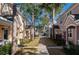Townhouses with a tree-lined walkway at 3383 Westchester Square Blvd # 202, Orlando, FL 32835