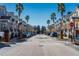 Street view of townhouses with palm trees and parked cars at 3383 Westchester Square Blvd # 202, Orlando, FL 32835