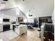 Open floor plan boasting a modern kitchen with stainless steel appliances and a spacious living area at 3383 Westchester Square Blvd # 202, Orlando, FL 32835
