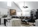 Open concept living room with sectional sofa and large TV at 3383 Westchester Square Blvd # 202, Orlando, FL 32835