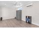 Light and airy bedroom with a gray closet and wood-look floors at 12039 Lakeshore Way, Oxford, FL 34484