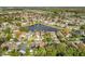 Aerial view of neighborhood with central lake at 12624 Maribou Cir, Orlando, FL 32828