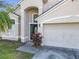 Front view of the house, showing the entrance and garage at 12624 Maribou Cir, Orlando, FL 32828