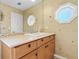 Vanity with wood cabinets in a light-colored bathroom at 146 Spring Chase Cir, Altamonte Springs, FL 32714