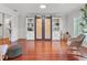 Living room with hardwood floors, built-in shelving and a sliding barn door at 146 Spring Chase Cir, Altamonte Springs, FL 32714