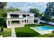 Luxury home with pool and expansive backyard, showcasing modern design at 2161 Sharon Rd, Winter Park, FL 32789