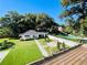 Backyard with pool, guest house, and expansive lawn at 2161 Sharon Rd, Winter Park, FL 32789