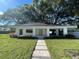 Modern house with walkway leading to the front porch at 2161 Sharon Rd, Winter Park, FL 32789