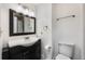 Simple bathroom with single vanity and dark cabinetry at 2351 Westwood Dr, Longwood, FL 32779