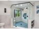 Large walk-in shower with blue tile floor and built-in seating at 2351 Westwood Dr, Longwood, FL 32779