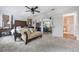 Spacious primary bedroom with a large bed and sitting area at 2351 Westwood Dr, Longwood, FL 32779