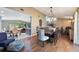 Bright dining area with hardwood floors, large table, and view of kitchen at 2351 Westwood Dr, Longwood, FL 32779
