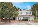 Two-story house with brick facade, landscaping, and a brick driveway at 2351 Westwood Dr, Longwood, FL 32779