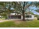 View of the home's exterior, showcasing the backyard and landscaping at 2351 Westwood Dr, Longwood, FL 32779