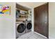 Updated laundry room with side-by-side washer and dryer at 2351 Westwood Dr, Longwood, FL 32779