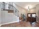 Wooden staircase with an ornate iron railing leading to the second floor at 2351 Westwood Dr, Longwood, FL 32779