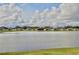 Community view of lakefront homes and landscaping at 2430 Bittle Way, Saint Cloud, FL 34769