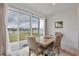 Bright dining area with sliding glass doors leading to the backyard at 2430 Bittle Way, Saint Cloud, FL 34769