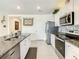 Modern kitchen with stainless steel appliances and granite countertops at 3613 Yarian Dr, Haines City, FL 33844