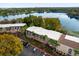 Aerial view showcasing the community's location near a lake at 3954 Versailles Dr # 3954B, Orlando, FL 32808