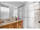 Bathroom featuring a shower stall, vanity, and mirror at 3954 Versailles Dr # 3954B, Orlando, FL 32808