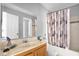 Bathroom with a shower/tub combo and wood vanity at 3954 Versailles Dr # 3954B, Orlando, FL 32808