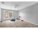 Bright bedroom with a window, ceiling fan, and carpeted floor at 3954 Versailles Dr # 3954B, Orlando, FL 32808