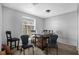 Small dining area with a square table and four chairs at 3954 Versailles Dr # 3954B, Orlando, FL 32808