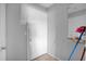 Clean entryway with a white door and small console table at 3954 Versailles Dr # 3954B, Orlando, FL 32808