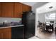 Kitchen offering ample counter space and a view into the dining area at 3954 Versailles Dr # 3954B, Orlando, FL 32808