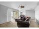 Spacious living room with a large sectional sofa and access to a patio at 3954 Versailles Dr # 3954B, Orlando, FL 32808