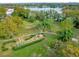 Landscaped playground with equipment and lake view at 4008 Versailles Dr # 4008C, Orlando, FL 32808