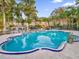 Community pool with gazebo and lush landscaping at 4008 Versailles Dr # 4008C, Orlando, FL 32808