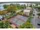 Two tennis courts with parking area and lake view at 4008 Versailles Dr # 4008C, Orlando, FL 32808