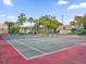 Two tennis courts with surrounding trees at 4008 Versailles Dr # 4008C, Orlando, FL 32808