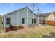 Enclosed patio and fenced backyard with landscaping at 425 Tree Shore Dr, Orlando, FL 32825
