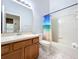 Clean bathroom with tub, toilet and wood vanity at 425 Tree Shore Dr, Orlando, FL 32825