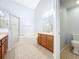 Bathroom with double sinks, soaking tub and shower at 425 Tree Shore Dr, Orlando, FL 32825