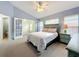Spacious bedroom with carpeted floor and ensuite bathroom access at 425 Tree Shore Dr, Orlando, FL 32825