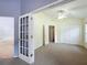 Bedroom with double door entry and ceiling fan at 425 Tree Shore Dr, Orlando, FL 32825