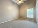 Bright bedroom featuring a ceiling fan and carpet at 425 Tree Shore Dr, Orlando, FL 32825