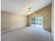 Spacious bedroom with sliding glass doors to patio at 425 Tree Shore Dr, Orlando, FL 32825
