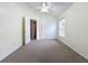 Well lit bedroom with double door closet and carpet at 425 Tree Shore Dr, Orlando, FL 32825